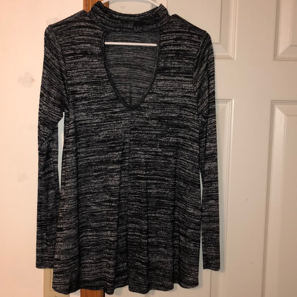 long sleeve sweater with cut v out on the chest.